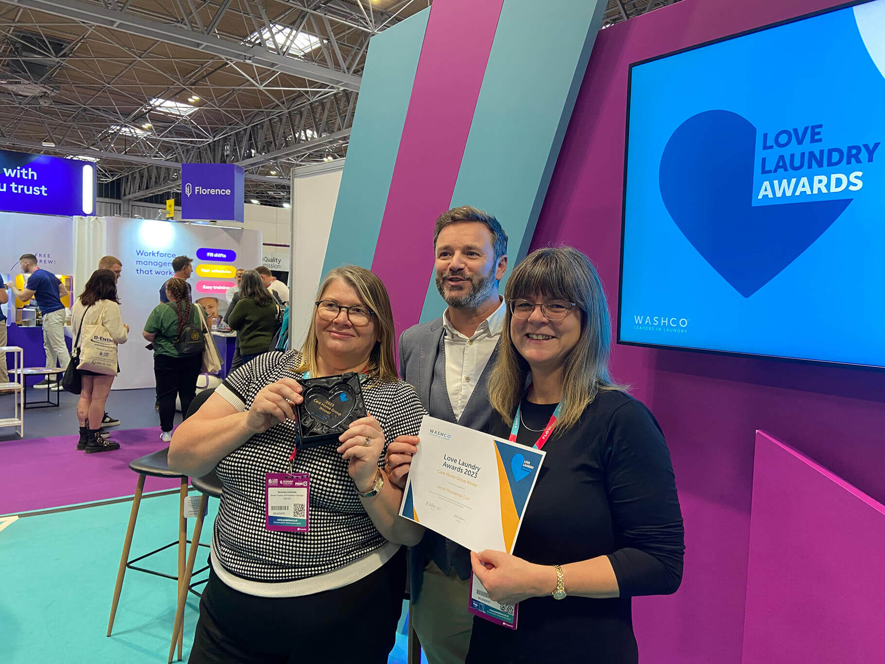 WASHCO's managing director presents care home group winners with award